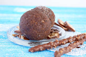 Cupcake with chocolate on wooden background