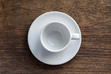 Empty coffee cup on old wooden