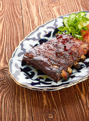Meat on a grill with vegetables