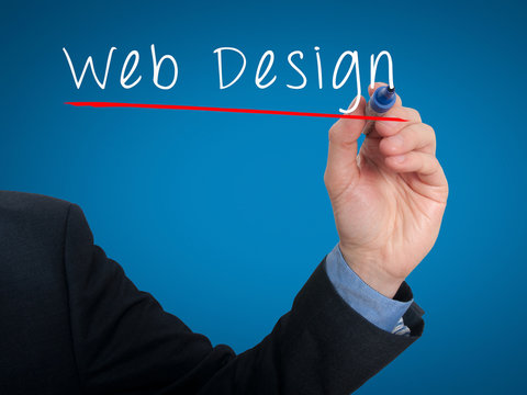 Businessman writing Web Design concept. Stock Photo