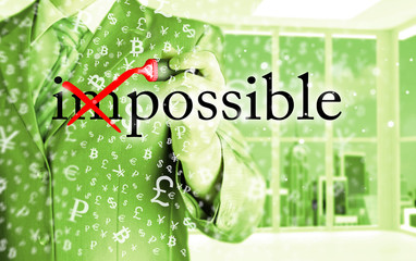 Businessman Hand turning the word Impossible into Possible with