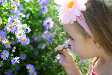 pretty little girl near colors