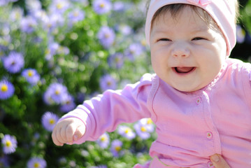 pretty little girl near colors