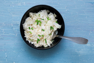 salad in a plate on a blue background