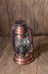 kerosene lamp on a wooden background