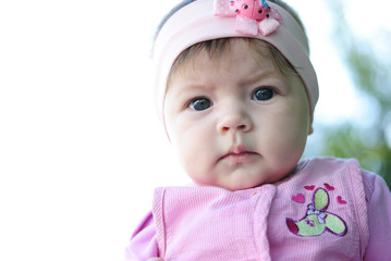 pretty little girl near colors