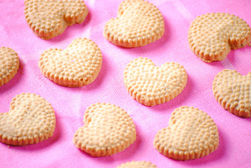 Heart shaped cookies on pink cloth