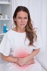 Obraz na płótnie Canvas Woman having bad stomachache