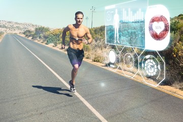 Athletic man jogging on open road with monitor around chest