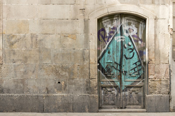 Antique door and wall in the street.