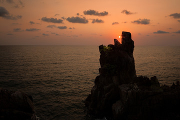 Sunset over the sea with cliffs like eating dun