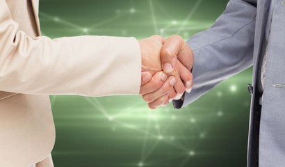 Composite image of close up of people shaking hands