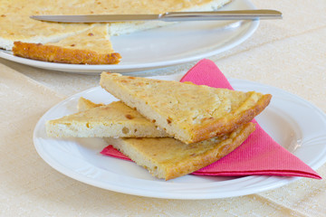 Barbotta slices on plate. Lunigiana speciality, Italy
