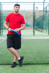 man in the paddle tennis field