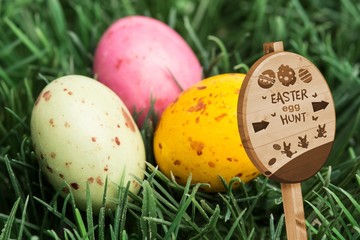 Composite image of easter egg hunt sign