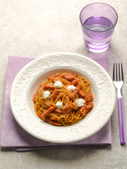 spaghetti with bacon mozzarella and tomato sauce
