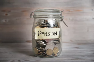 Money jar with pension label. © WONG SZE FEI