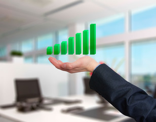 Businessman holding graph in his hand . Isolated on office