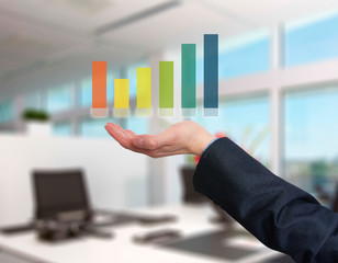 Businessman holding graph in his hand . Isolated on office