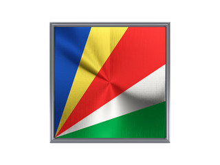 Square metal button with flag of seychelles