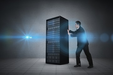 Composite image of businessman standing and pushing