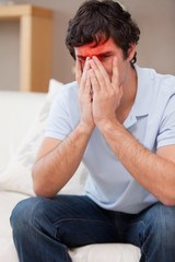 Desperate man sitting on the sofa