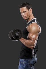 Fototapeta na wymiar Muscle man lifting weights
