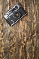 Camera. Vintage camera on wooden background