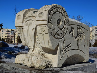 Stone statue in abstract style featuring a wether, in Astana