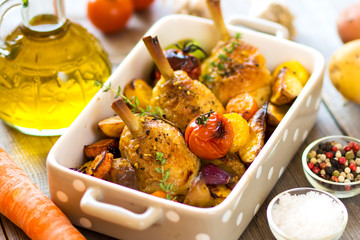 Crispy Baked Chicken Leg with vegetables and herbs