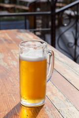 beer glass on a little table of cafe