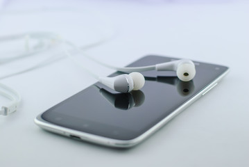 Small headphones with mobile phone