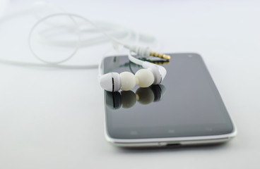 Small headphones with mobile phone