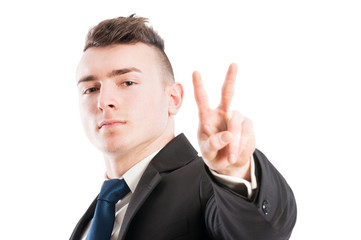 Business man showing peace or victory sign