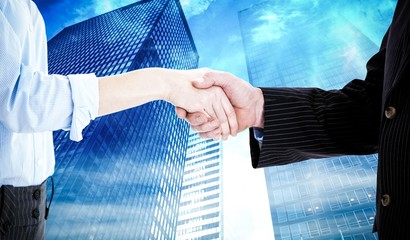 Composite image of close up of a business people closing a deal