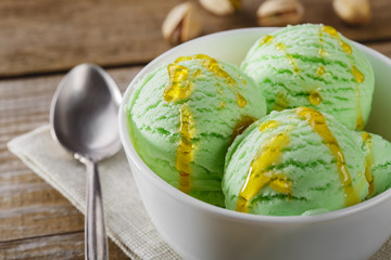 pistachio ice cream ball poured maple syrup