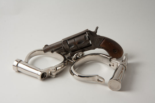 Old Handcuffs And Revolver