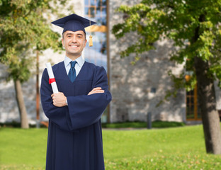 smiling adult student in mortarboard with diploma