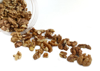 walnuts spill out of the plastic container