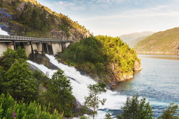 Fototapeta na wymiar Road in Norway passing over the waterfall Langfoss