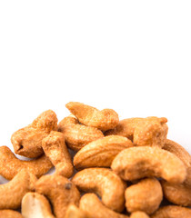 Roasted and salted cashew nut over white background