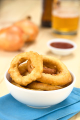 Freshly prepared homemade beer-battered onion rings