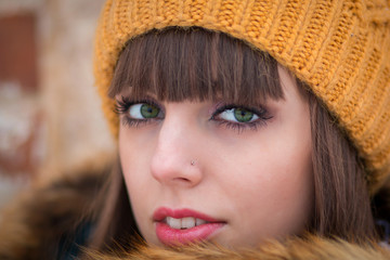 Portrait of beautiful girl in winter hat