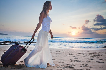 Fototapeta na wymiar Woman adventure with own luggage