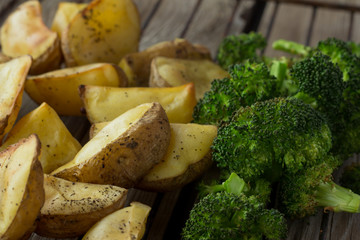 Potatoes and broccoli on grill
