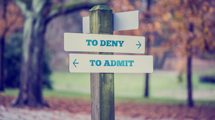Sign Post Pointing Toward Choices in Honesty