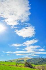 Sun and Blue sky green hill in New Zealand