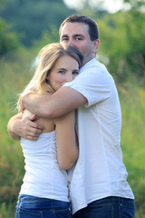 A nice young couple in love  hugging outdoors