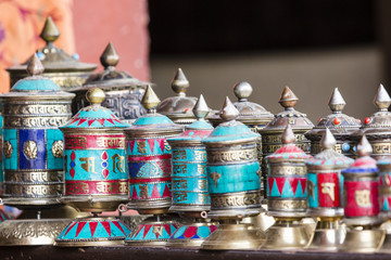 Traditional tibetan praying wheels in Nepal.