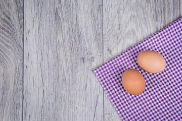 Eggs on wooden background in rustic style